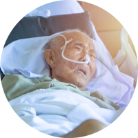 Elderly Man in a Hospital Bed